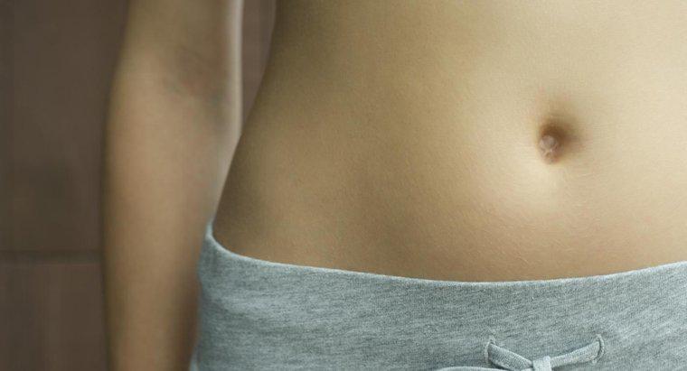 Điều gì gây ra đau xung quanh nút bụng, và đó có phải là dấu hiệu của việc mang thai?